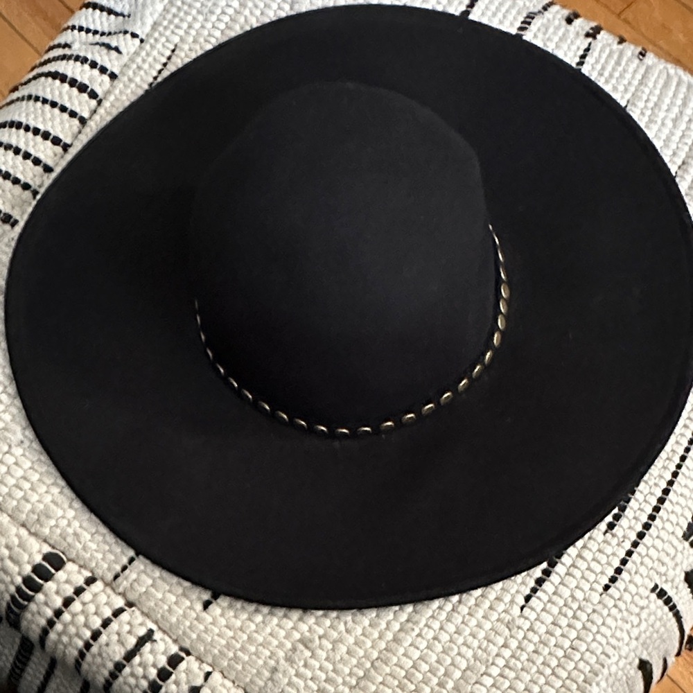 BCBGMaxAzria Elegant Black Hat with Gold Detailing